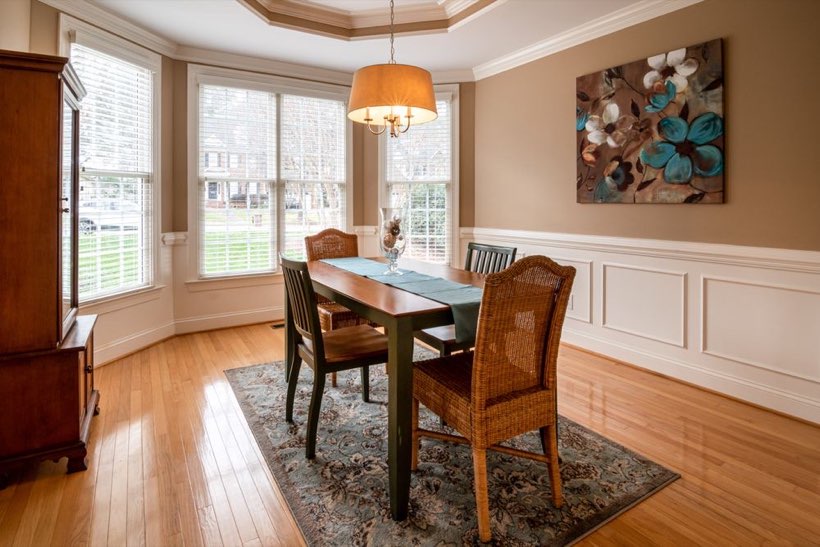 Light oak flooring in a bay-window dining room in the Highlands neighbourhood of Edmonton.