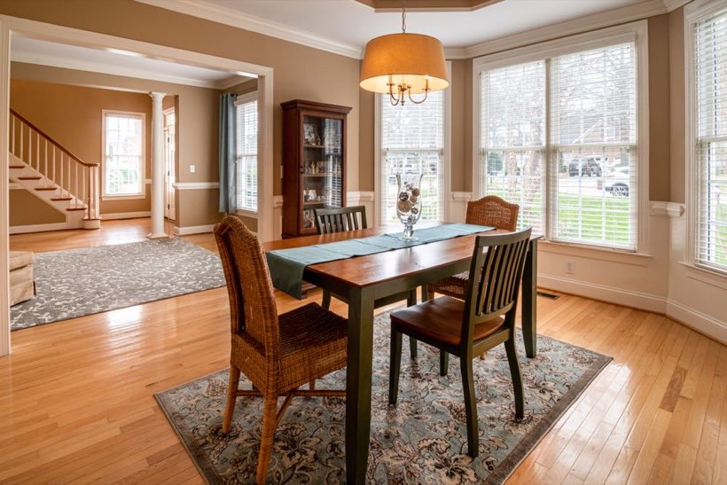 Oak floors running from a dining room through to the stairs in an Old Strathcona house.