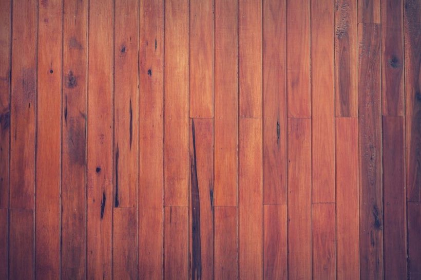 Deep red-brown stained oak boards in an Edmonton home after a sand and stain.
